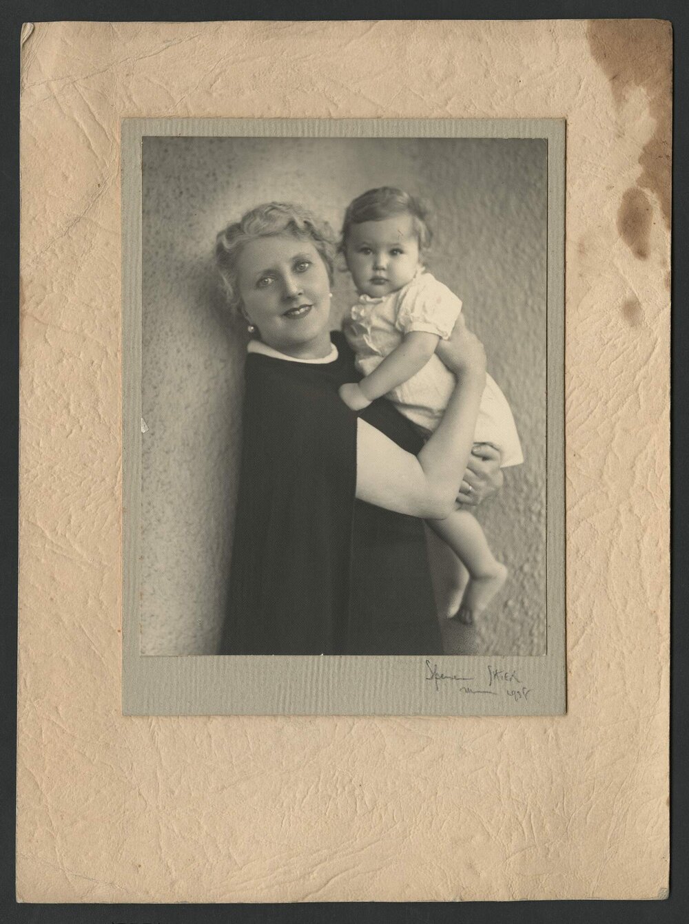 Portrait of Louise Dyer holding a baby