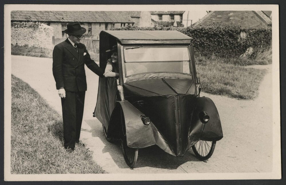 Jeff Hanson and Louise Hanson-Dyer with the bicycle car at Pin Farm Cottage