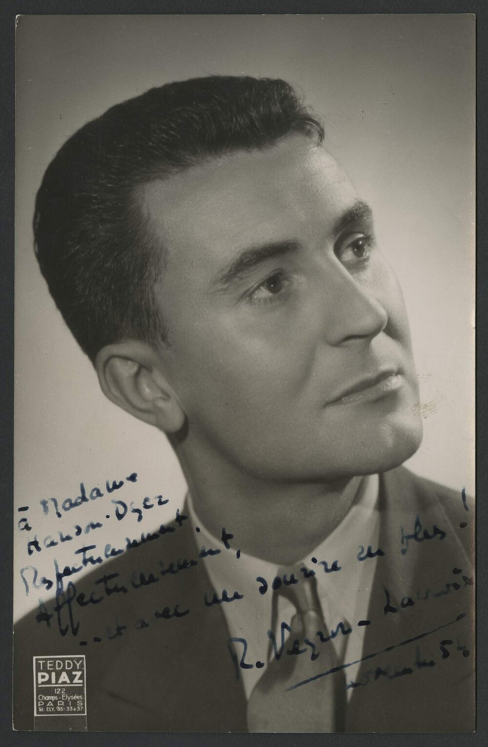 Promotional headshot of French harpsichordist Robert Veyron-Lacroix wearing a dark suit and tie