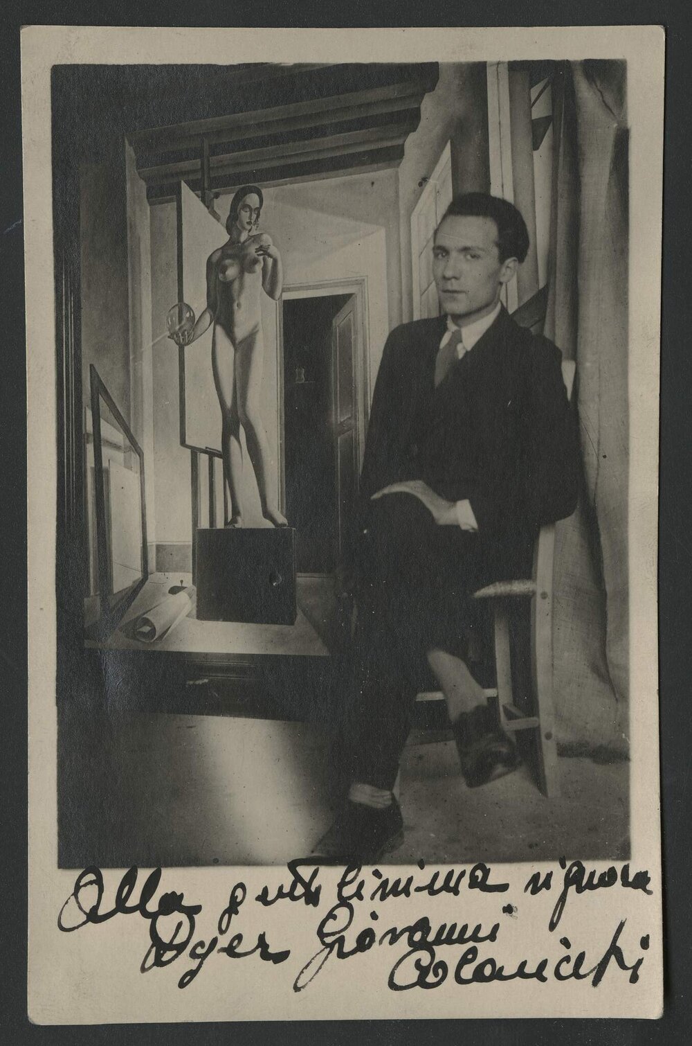 Italian painter Giovanni Colacicchi sitting with crossed legs in front of his 1924 oil on canvas La Malinconia