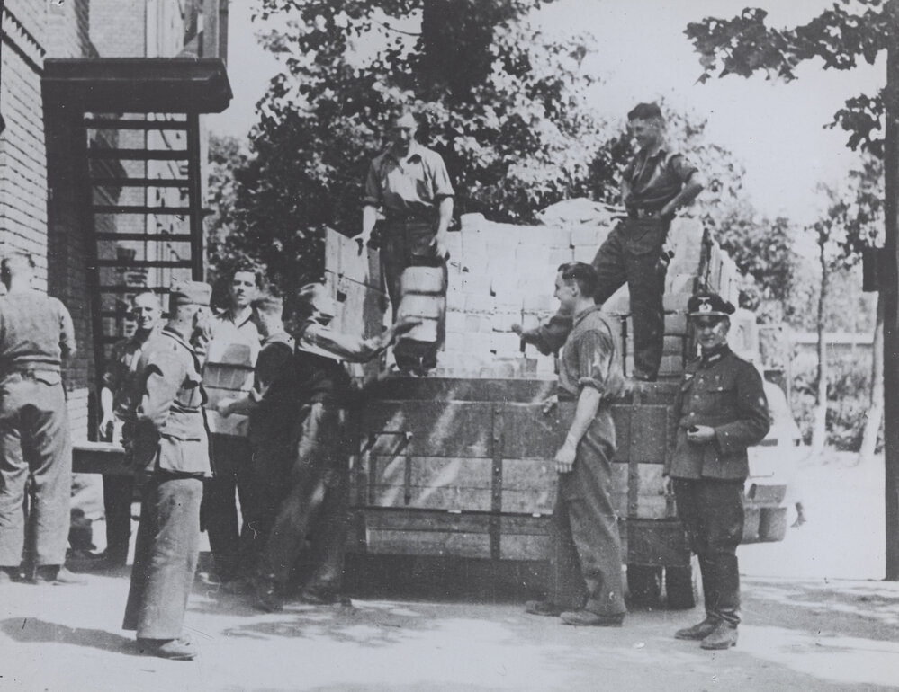 Prisoners of war camp: Stalag XX A. English Red Cross parcels being received and unloaded.Thorn, Germany