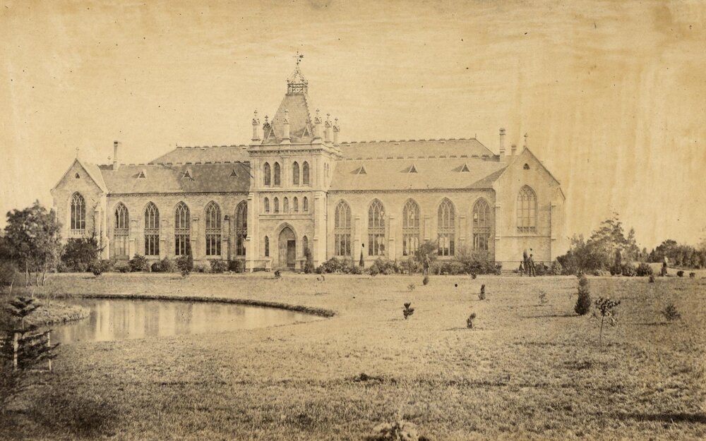 Eastern side of National Museum with lawn and lake in foreground, University of Melbourne, 1862-1899.