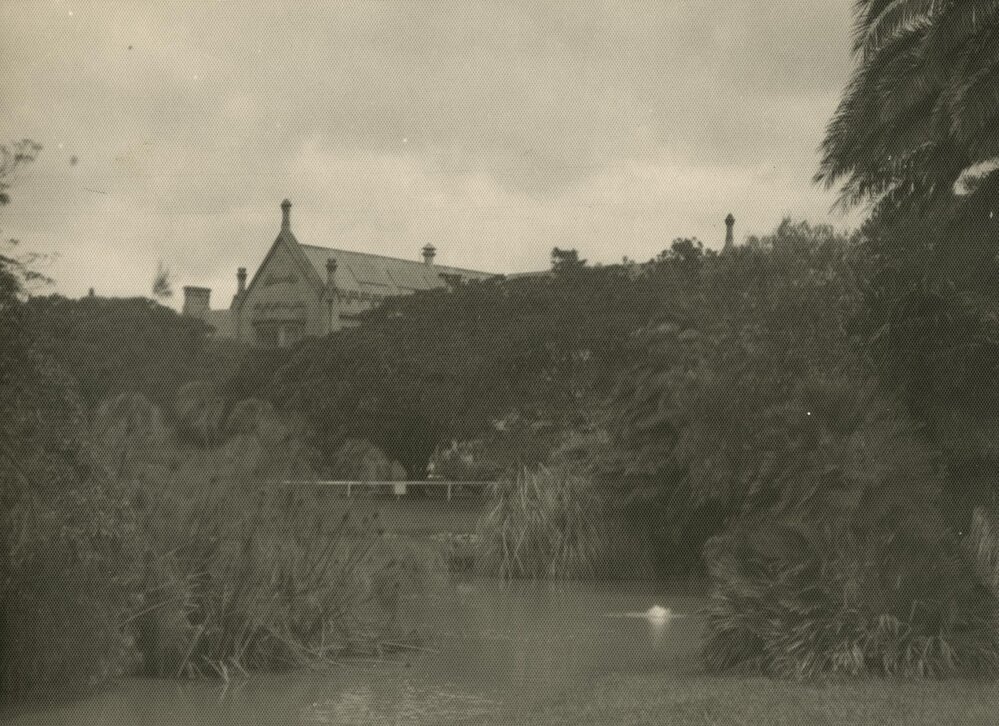 North-eastern corner of Main building with lake in foreground, University of Melbourne, circa 1936.