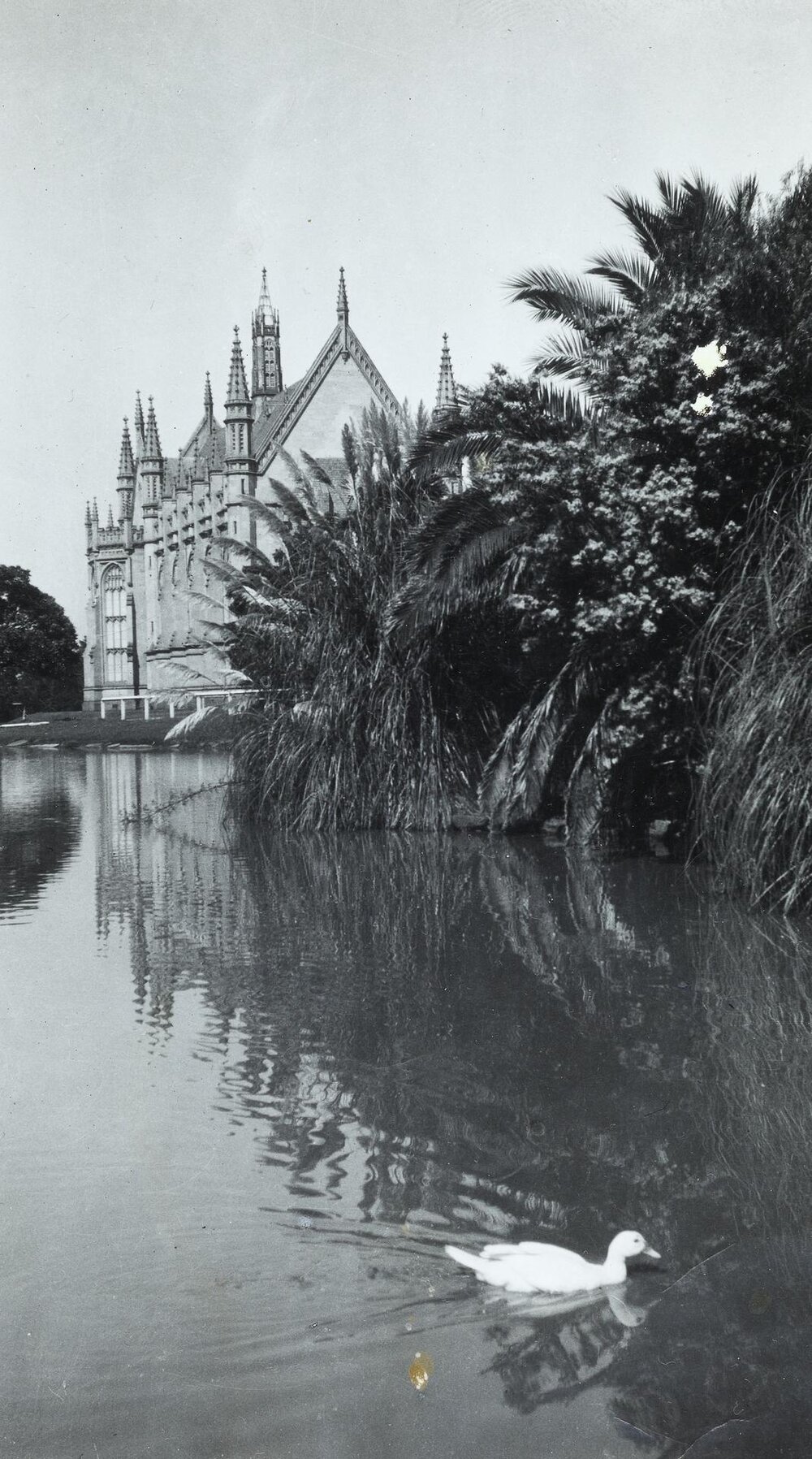 View across lake to Old Wilson Hall, University of Melbourne, circa 1930.