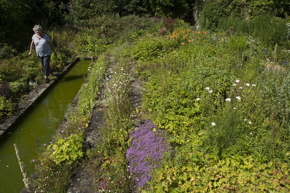 [Greer with garden and water feature]
