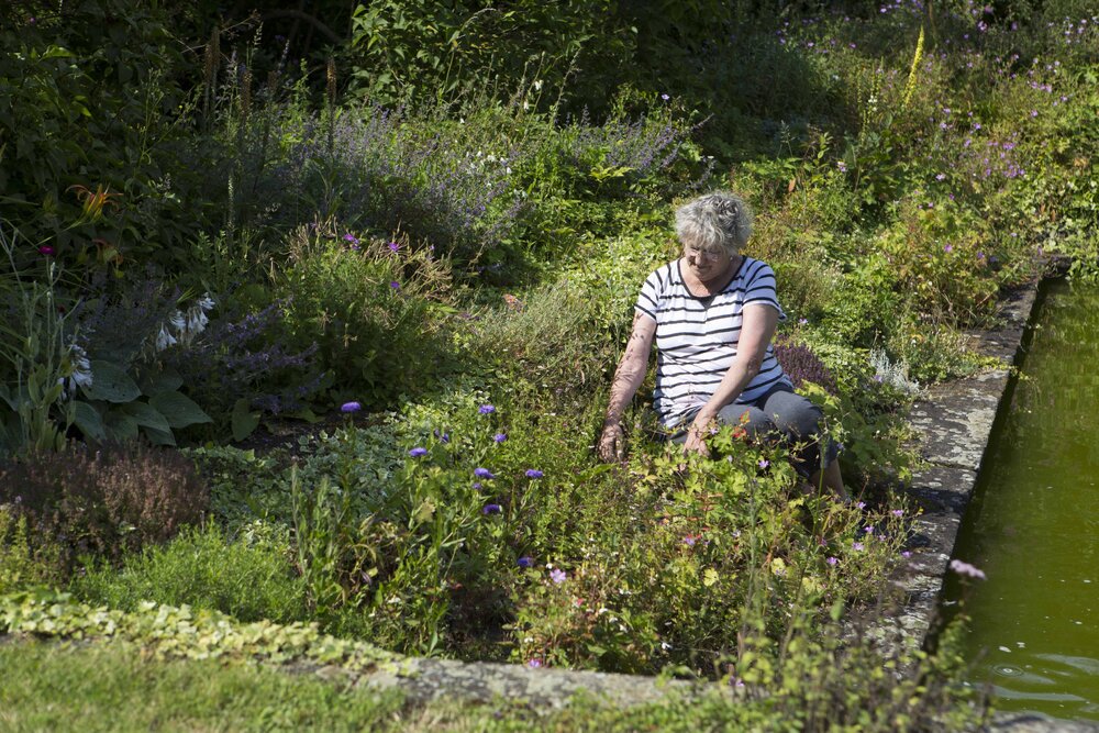 [Greer with garden and water feature]
