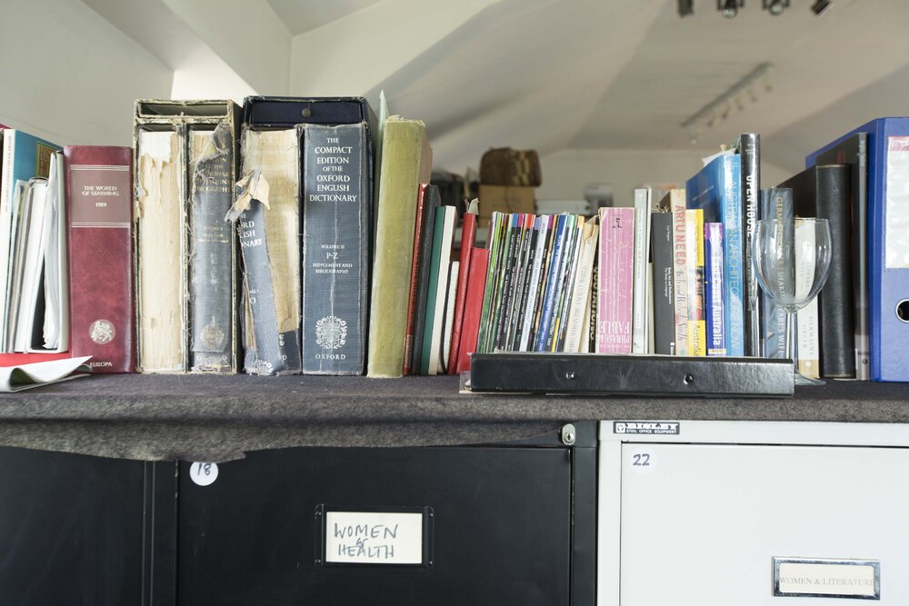 [Books on top of filing cabinets]
