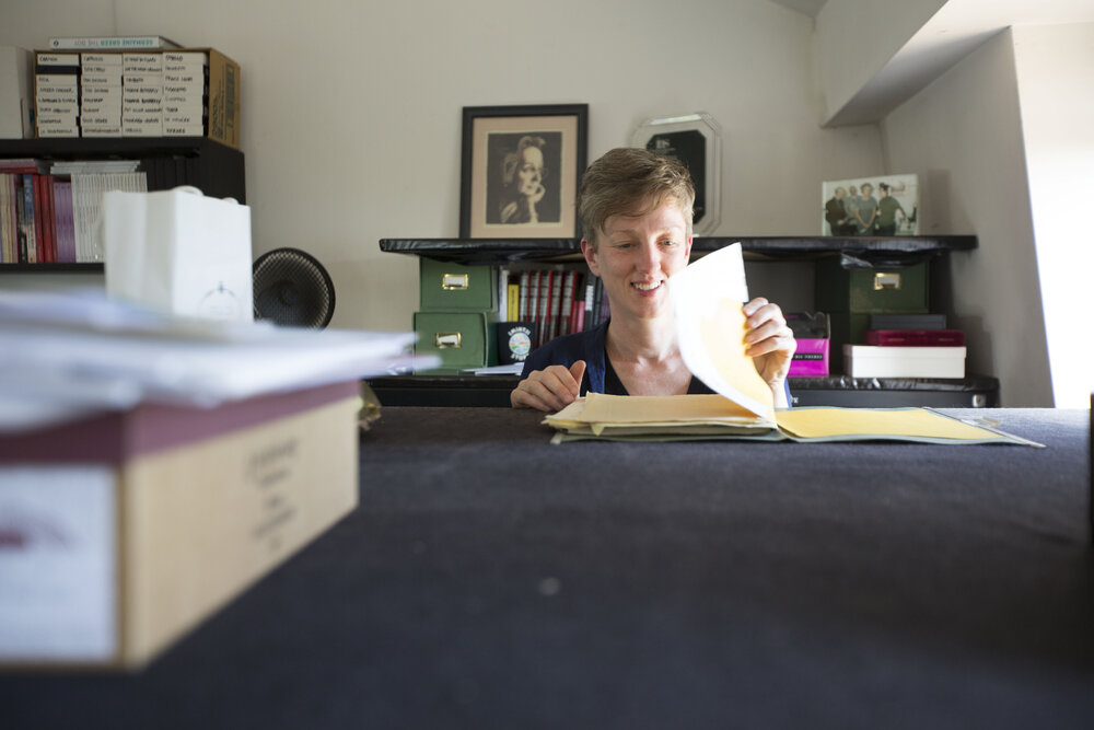 [Katrina Dean with file, Office]