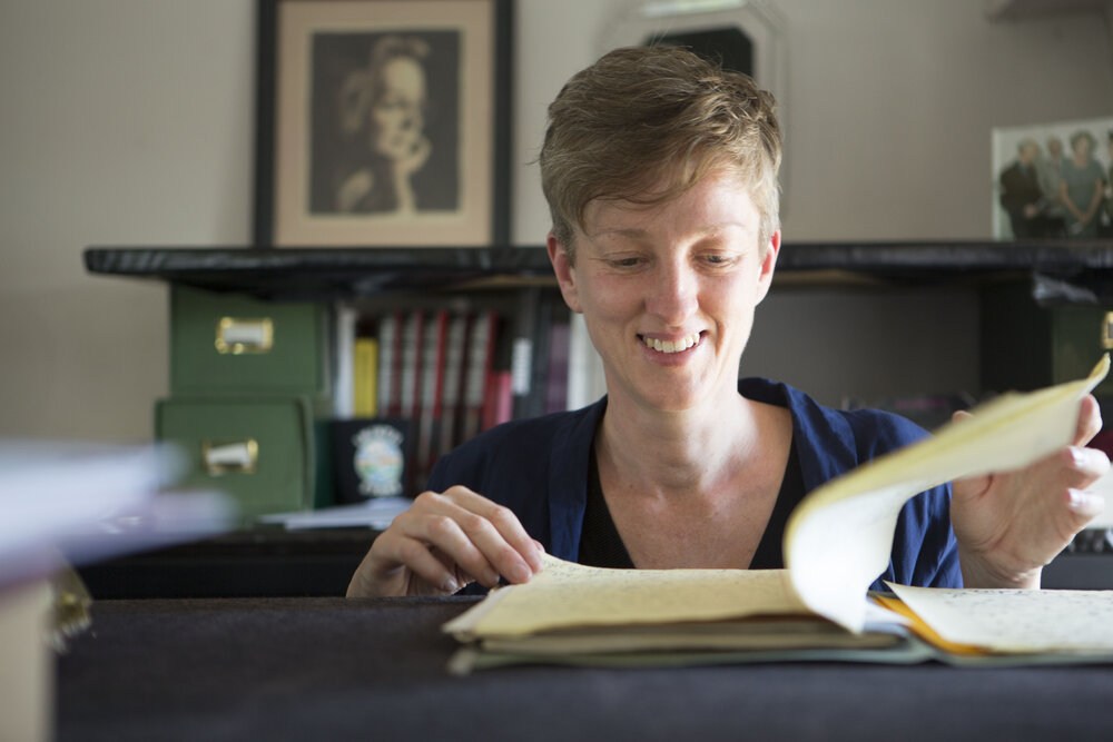 [Katrina Dean with file, Office]