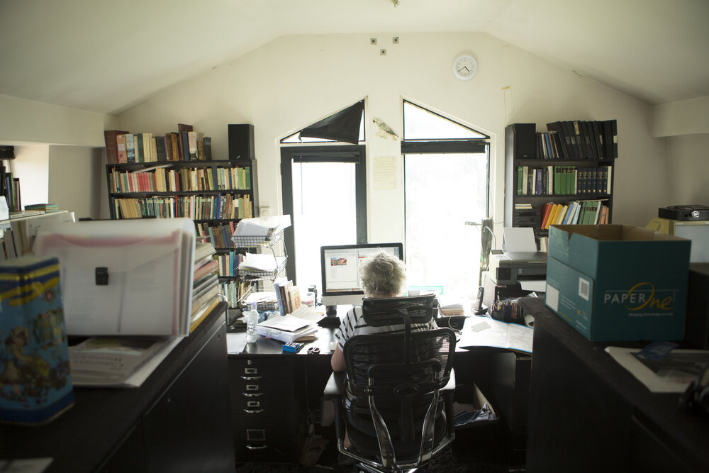 [Greer at desk from behind, Office]