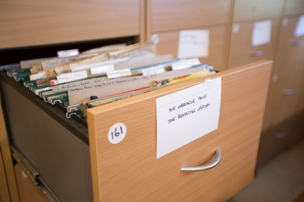 [Filing cabinet drawer The Obstacle Race, The Revolting Garden, Office]