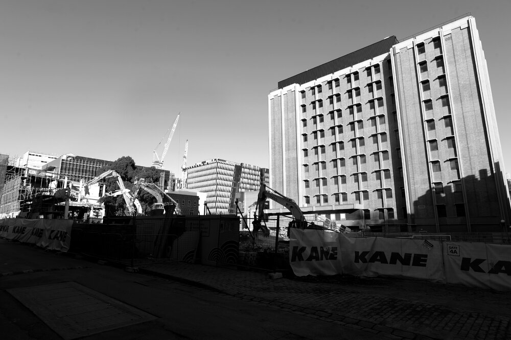 Parkville during COVID lockdown - New Student Precinct Construction Site photographed from Monash Rd - Doug McDonell building in background - Monochrome