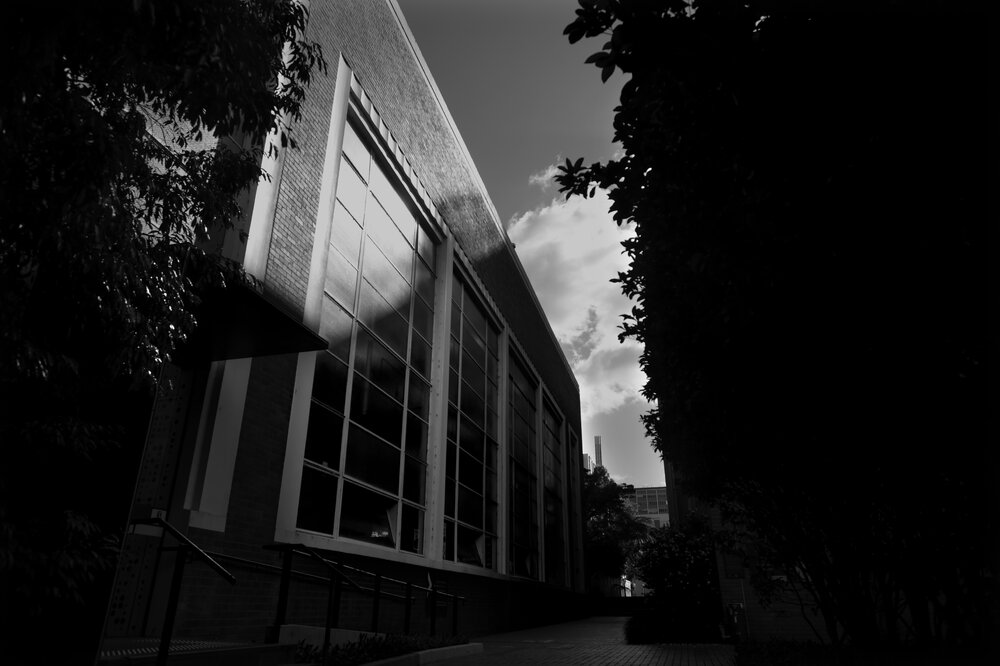 Parkville during COVID lockdown - Medtech Linkway entrance and east faade of Engineering Workshops - pathway looking north - Monochrome