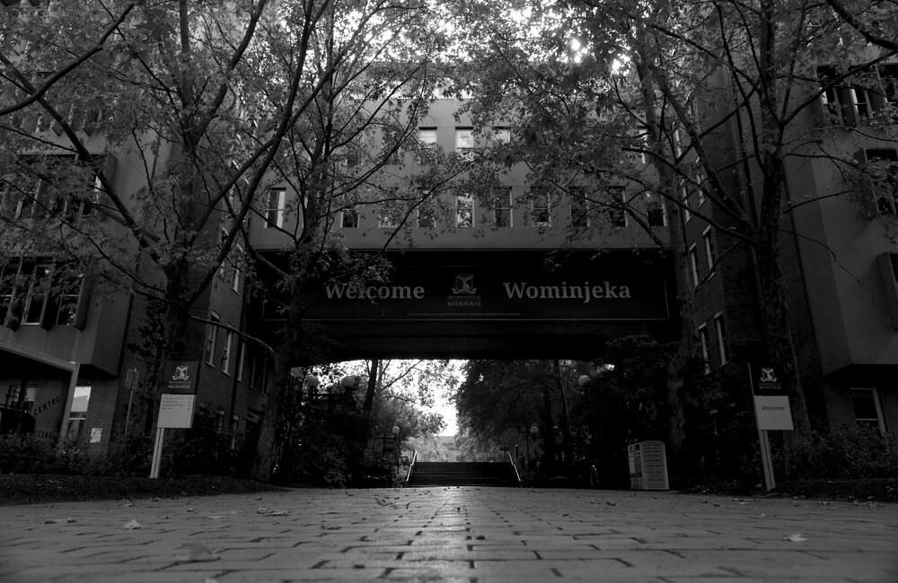 Parkville during COVID lockdown - John Medley Building welcome sign at Gate 10 - Monochrome