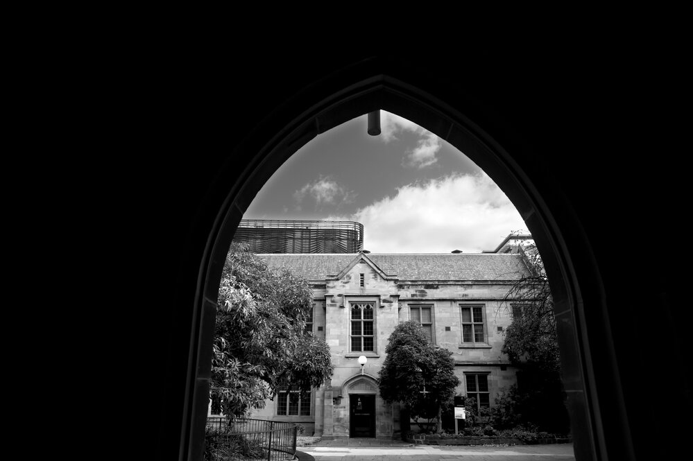 Parkville during COVID lockdown - Photographed from Old Quadrange Building looking across Cussonia Court towards faade of Old Arts Building - Monochrome