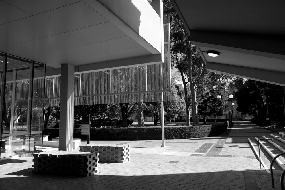 Parkville during COVID lockdown - Walkway looking west between Glyn Davis Building and Redmond Barry Building - Monochrome