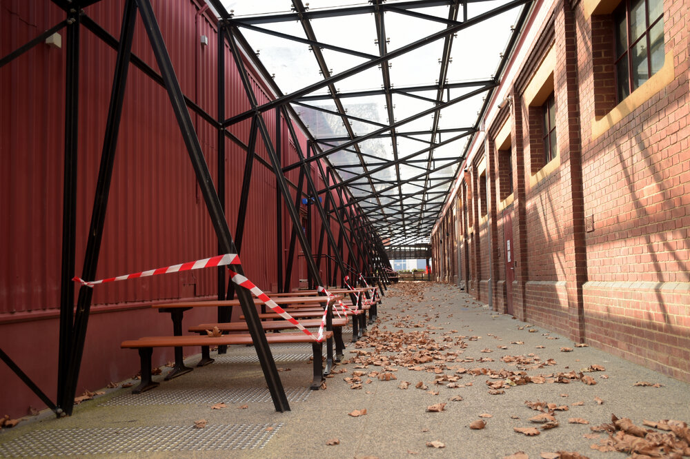 Southbank Campus during COVID lockdown - Closed off seating study area during stage 3 and 5 restrictions in walkway between Red Shed Building and Grant St Theatre