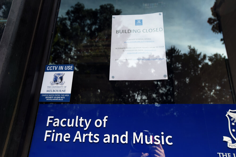 Southbank Campus during COVID lockdown - Building closed door signage includes email addresses for additional information - Faculty of Fine Arts and Music