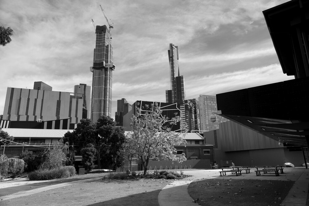 Southbank Campus during COVID lockdown - Wilin Garden looking towards The Stables with Melbourne City in the background - Monochrome