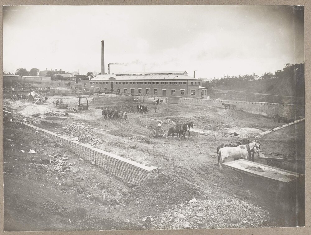 [Factory site in the early stages of construction]