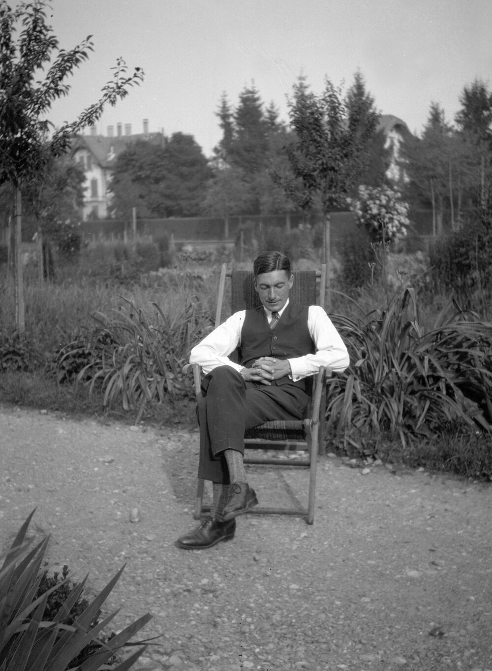 An unidentified man in a garden setting in or near Berne, Switzerland