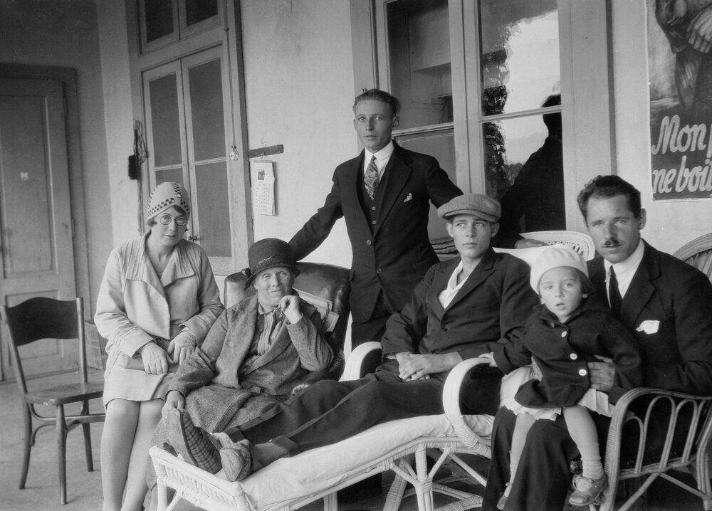 A  group of unidentified people on the verandah of a building in Vevey or Grusch[?], Switzerland