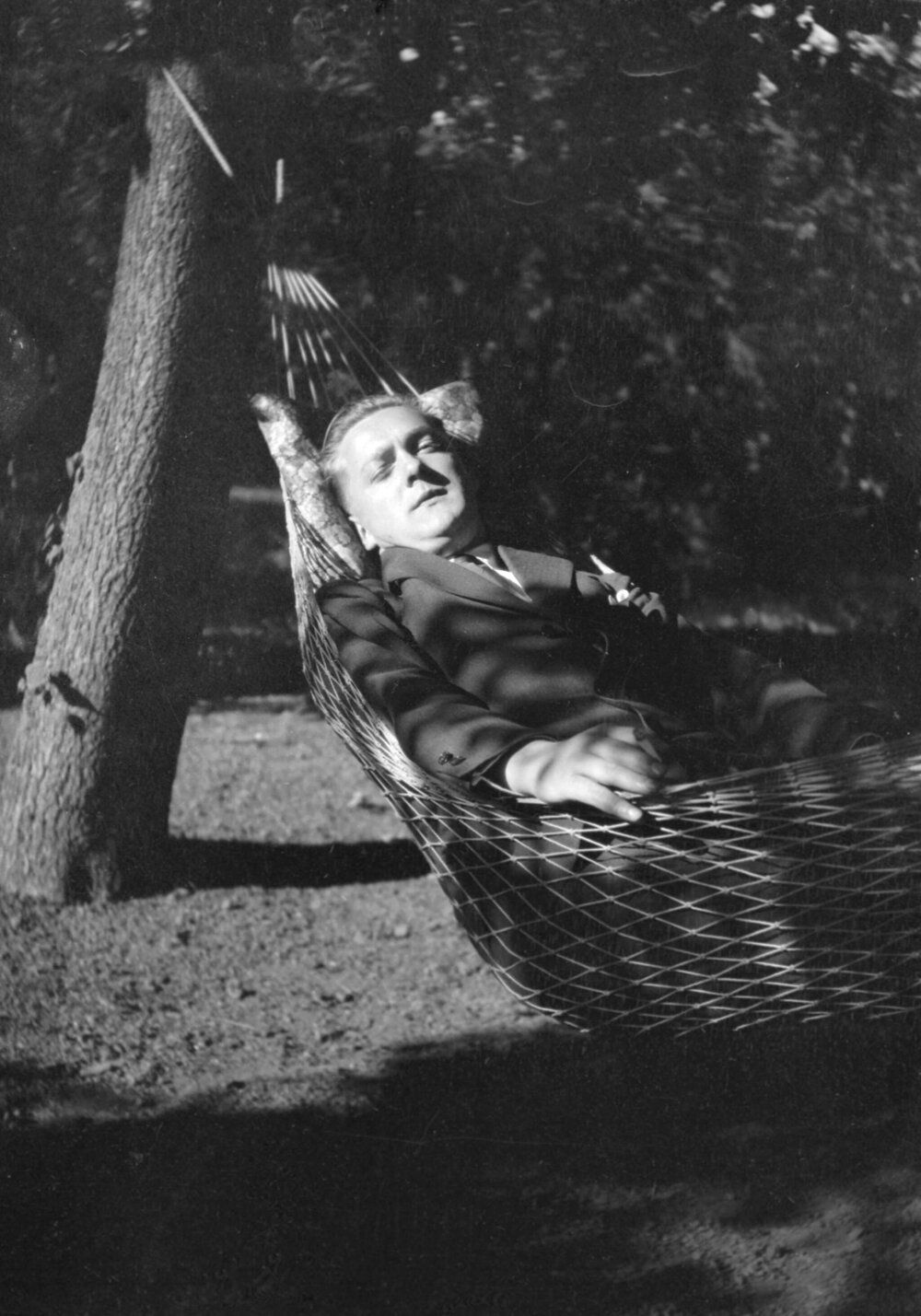 An unidentified man asleep in a hammock