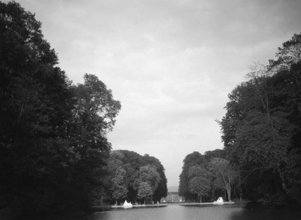 An unidentified lake, statuary and large building in Speyer, Germany or possibly Schwetzingen, near Heidelberg, Germany