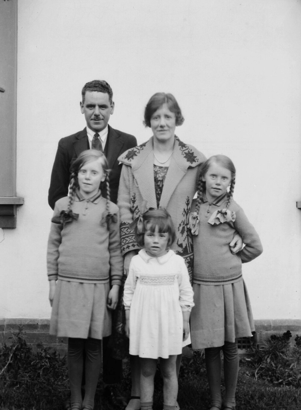 An informal outdoor portrait of an unidentified family group, probably at   Shepparton, Victoria or possibly at Mornington, Victoria