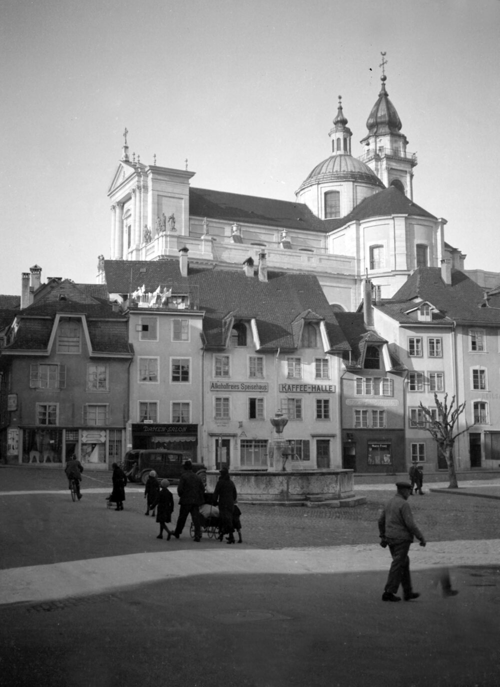 An unidentified urban scene with buildings, including a large church
