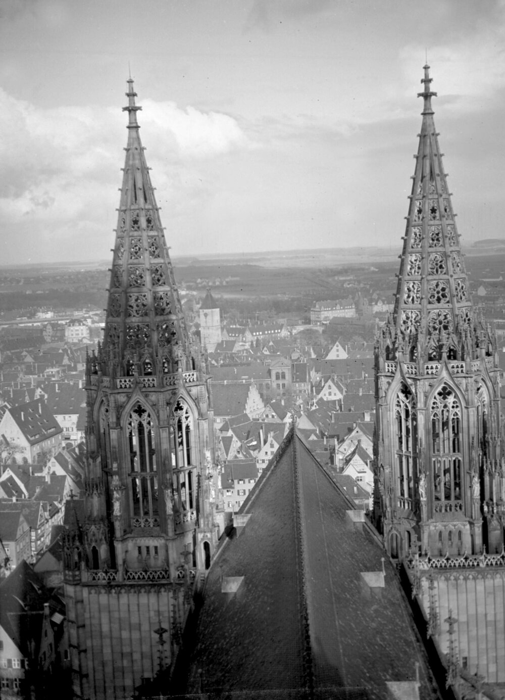 A view of spires and the roof of Ulm Munster, with some of Ulm visible beyond
