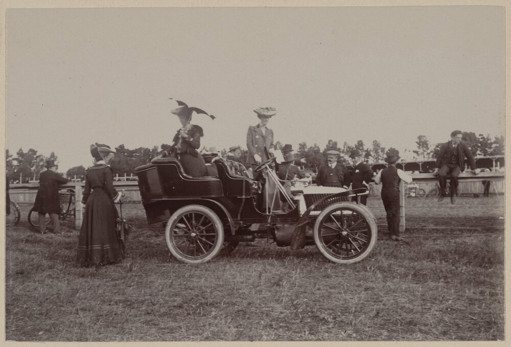 Women watching car racing at a motor club gymkhana at Maribyrnong, Victoria