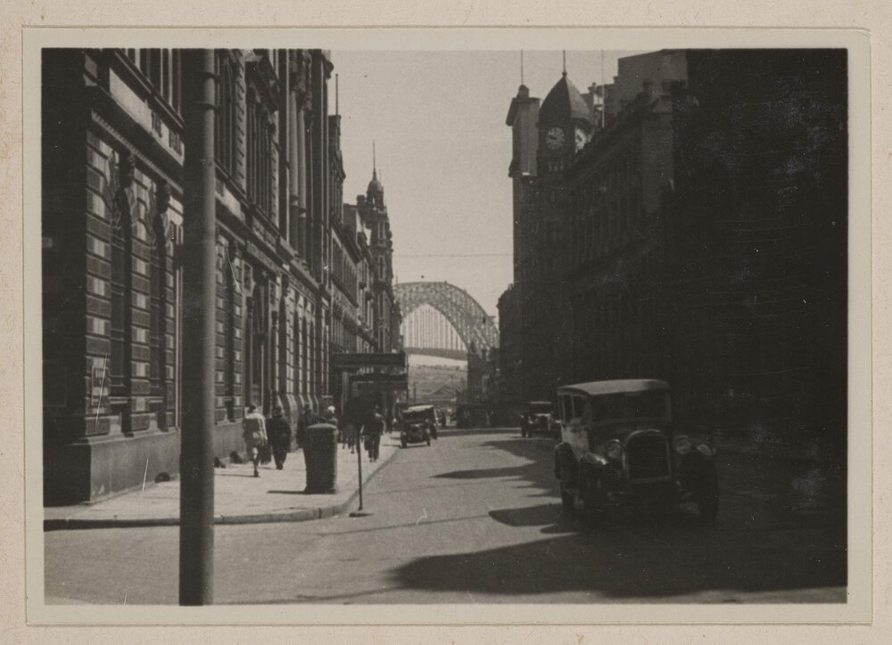 Sydney [streetscape and Harbour Bridge]