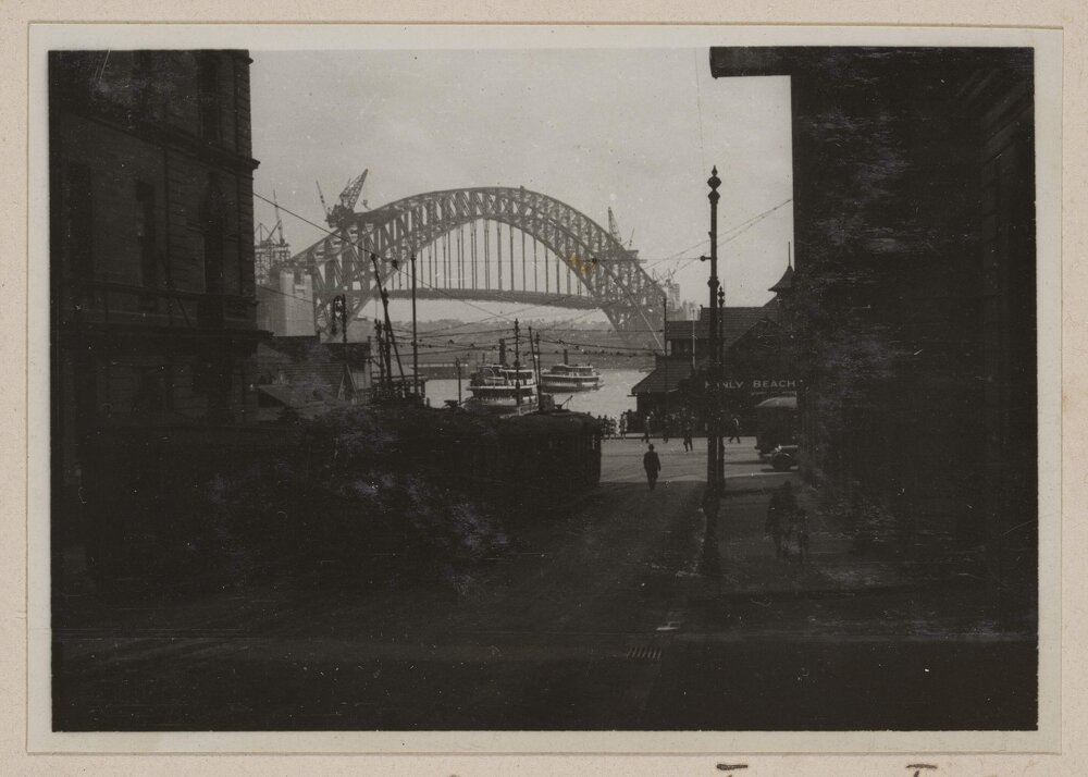 Sydney [streetscape and Harbour Bridge]