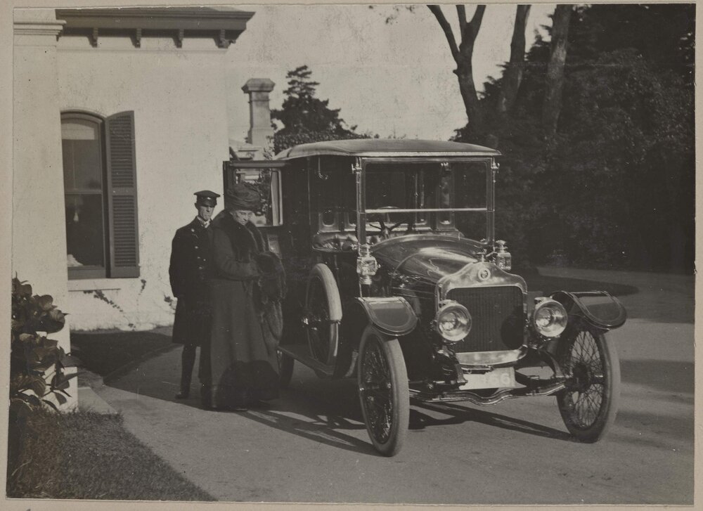 [Woman and car at] Miegunyah