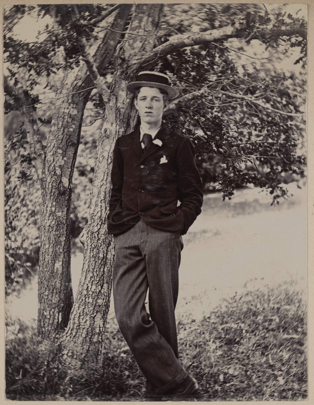 [Boy in suit and boat hat, flower in lapel] Coolart