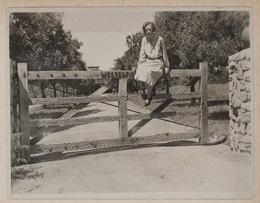 [Mab sitting on custom "Westerfield" timber entrance gate]