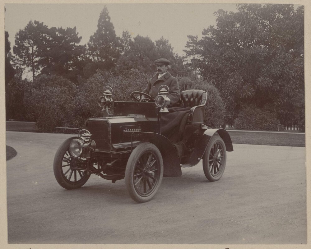 [Man seated in car, Harleston]
