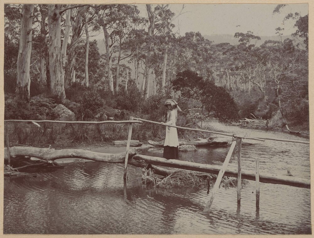 [Woman crossing river]
