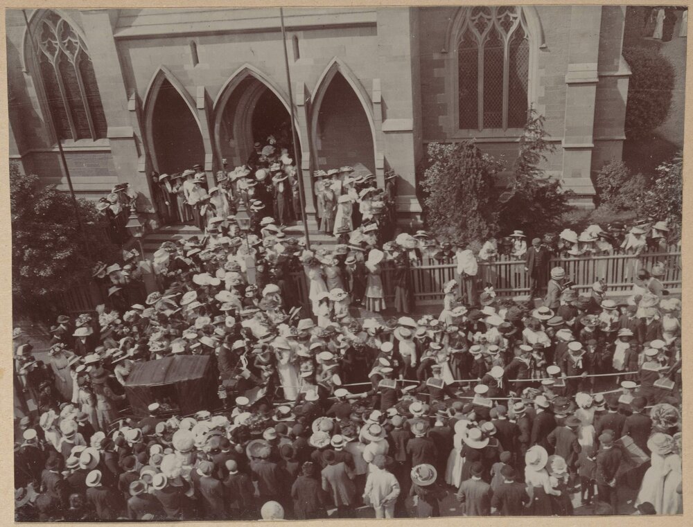 [Crowd watching procession]