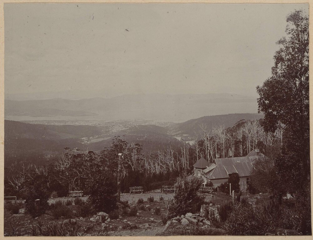 [Homestead in front of bare trees]