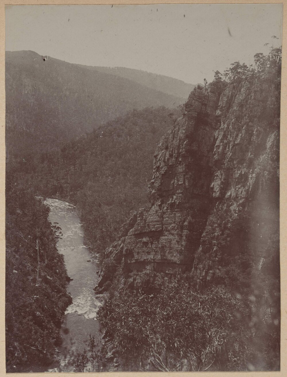 [River flowing between two cliffs]