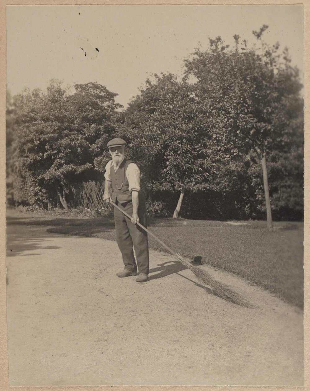 [Man with straw sweeper]