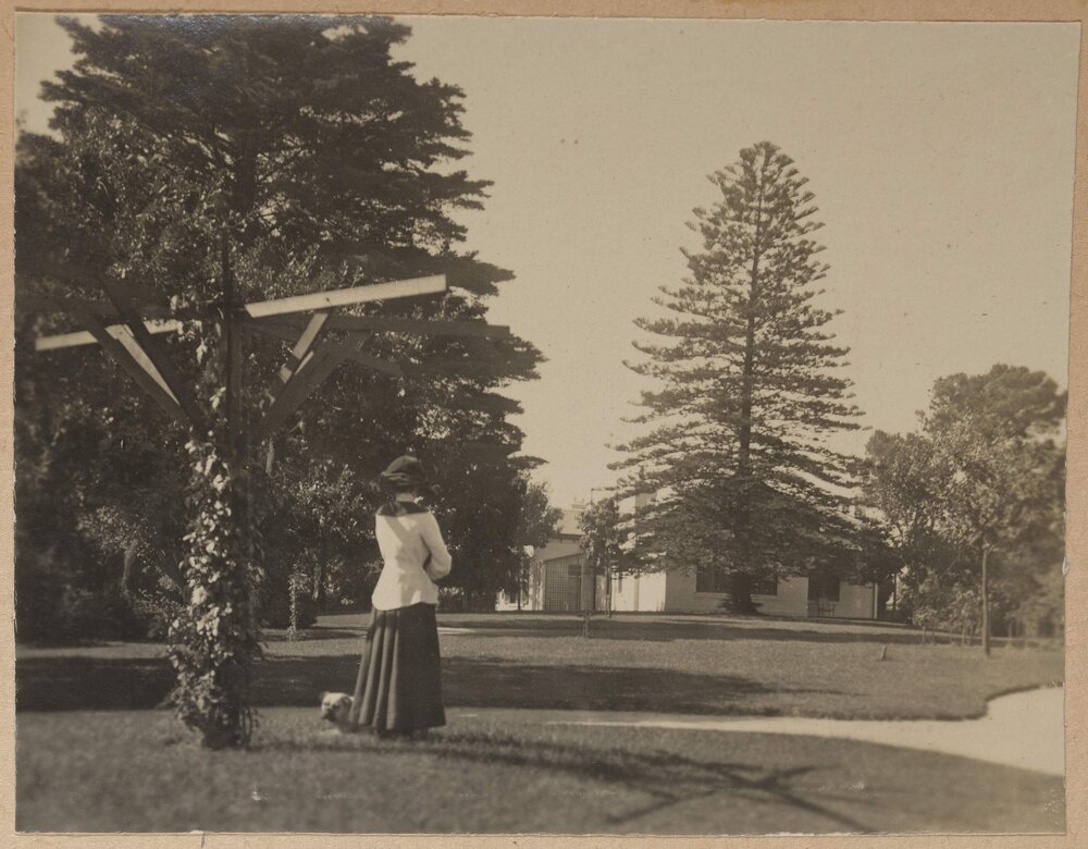 [Woman in garden at Miegunyah]