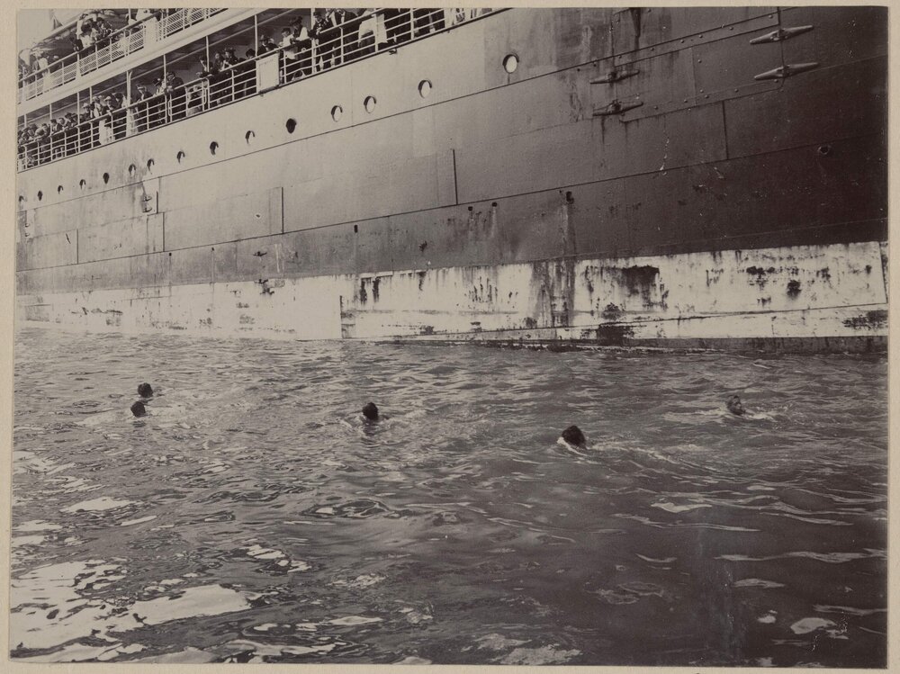Kanaka Boys swimming beside the 'Sierra'