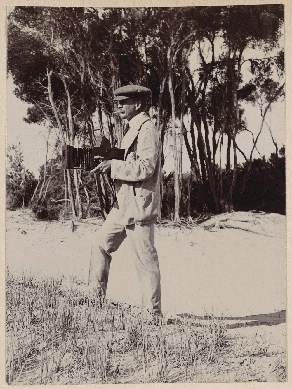 [Man holding camera, Coolart]