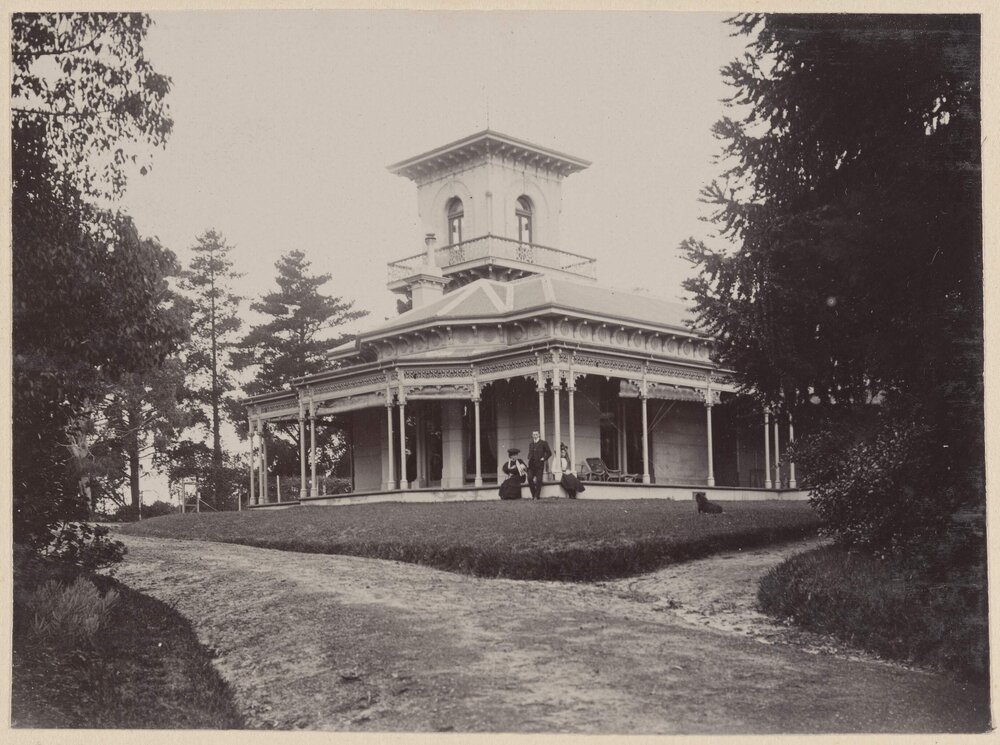 [External view of homestead with tower]