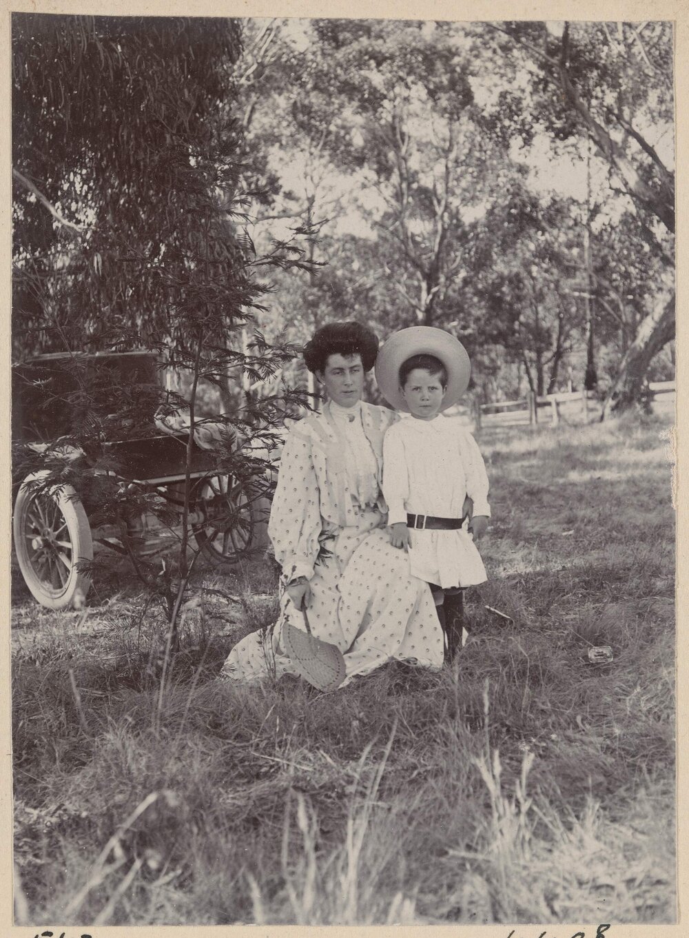 Woolwogong [kneeling woman and young boy]