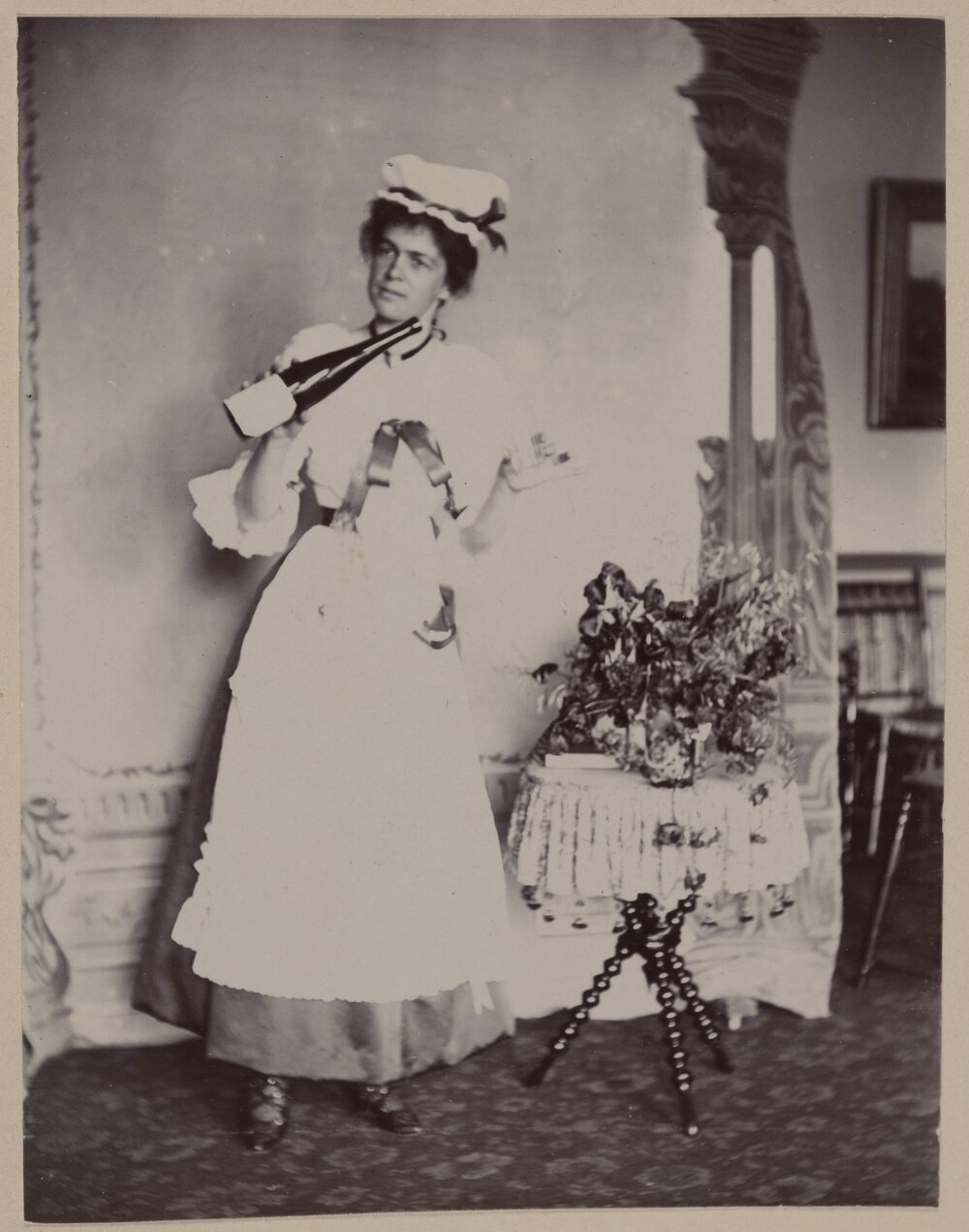 [Woman pouring drink from bottle]