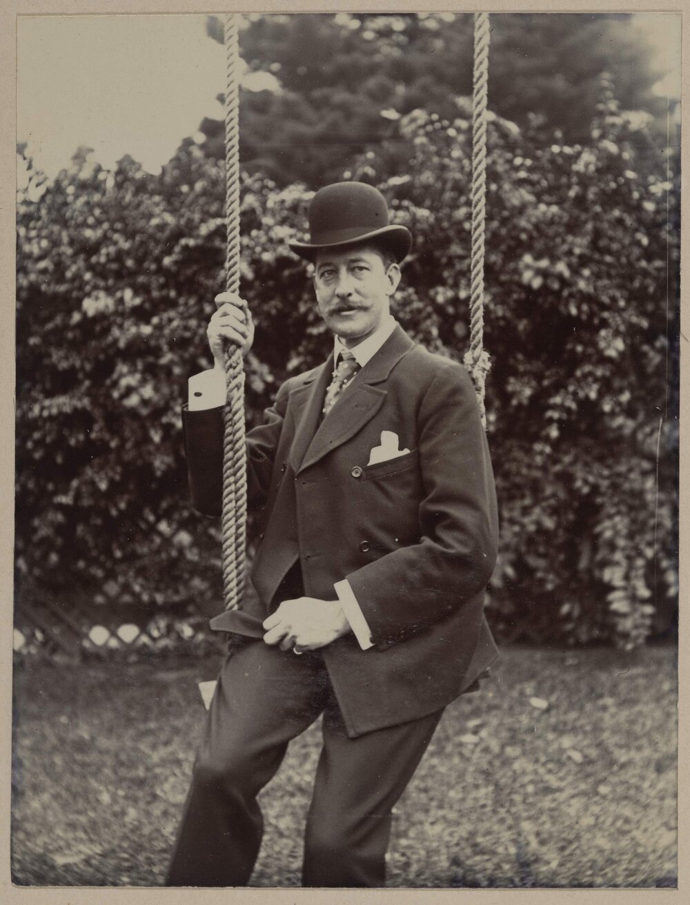 Harleston [man posing on swing]